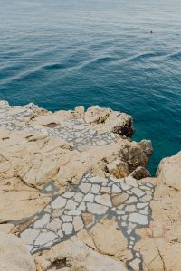 Rocky coastline on the Adriatic Sea in the small town of Rovinj, Croatia