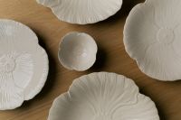 Kaboompics - Four White Ribbed Ceramic Plates and Small Bowl on Wooden Table, Overhead Flat Lay