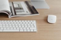 Kaboompics - White Apple Keyboard and Mouse with Design Magazine on Oak Desk, Copy Space
