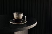 Kaboompics - Small Glass Coffee Cup on Black Round Table