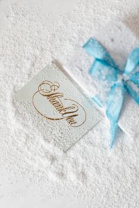 Kaboompics - Close-Up of Gold Thank You Lettering beside Frosted Christmas Gift