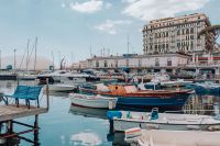 Kaboompics - Naples Marina Boats and Waterfront Hotel Reflected in Calm Water