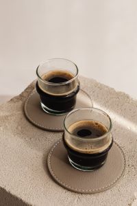 Kaboompics - Glass Espresso Pair on a Stone Block with Copy Space
