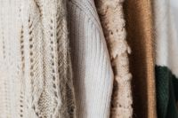 Kaboompics - Capsule Wardrobe of Neutral Sweaters on Rack