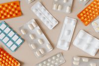 Kaboompics - Colorful Medicine Blister Packs on Beige, Pharmacy and Healthcare Background for Medication Safety Content