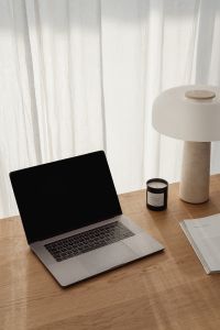 Kaboompics - Stone Lamp and Black Candle in a Sunlit Home Office