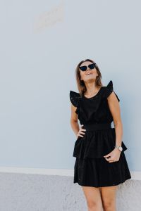 Kaboompics - Close-Up Fashion Portrait in Sunglasses Against a Pale Blue Wall