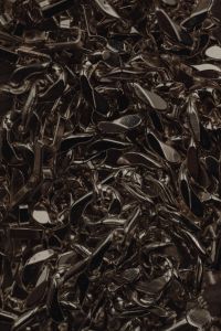 Kaboompics - Tangled Silver Jewelry Links in a Dark Macro Texture