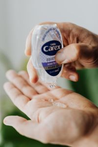 Kaboompics - Carex Hand Gel Bottle Dispensing into Open Palm