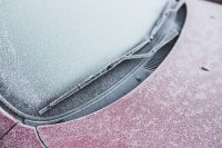 Kaboompics - Frost on a red car