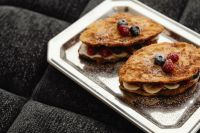 Kaboompics - French Toast Tray with Berry Sandwiches on a Sofa