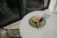 Kaboompics - Small Cake on a Round Outdoor Table