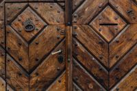 Kaboompics - Antique Double Door With Metal Rivets and Old Lock