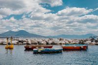 Kaboompics - Colorful Boats Moored Along the Naples Breakwater With Mount Vesuvius