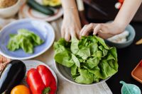 Kaboompics - Fresh Lettuce and Colorful Vegetables on Kitchen Table during Salad Prep