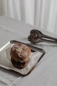 Kaboompics - Glazed Pastry with Metal Tongs on Silver Tray