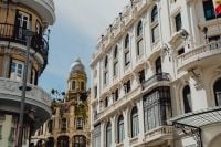 Kaboompics - Historic Madrid Street with a Bell Tower Between Apartment Facades