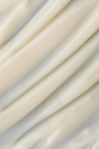 Kaboompics - Flowing Cream Texture Lines Close-Up on Neutral Background