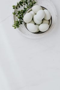 Kaboompics - Easter flat lay with green eggs on a white marble