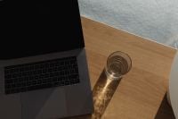 Kaboompics - Bright Home Office Desk with Water Glass and Long Shadows