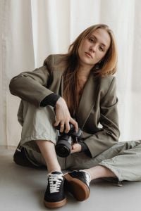 Kaboompics - Young Female Photographer Holding DSLR Camera Portrait