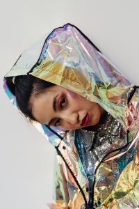 Futuristic Asian Model in Neon Green, Purple and Silver Holographic Fashion
