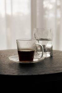 Kaboompics - Black Coffee in Glass Cup and Water Glass on Black Round Table