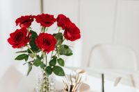 Kaboompics - Red Roses, Open Notebook and Pencil Cup on Bright Desk, Home Office Flat Lay
