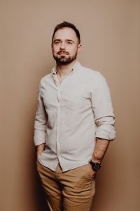 Kaboompics - Full-Length Portrait of a Bearded Man in White Shirt and Tan Trousers for Casual Professional Branding