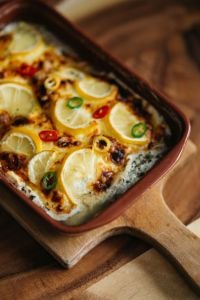 Kaboompics - Lemon Fish Bake in a Brown Ceramic Casserole Dish