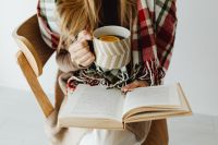 Kaboompics - Woman Reading a Book and Drinking Tea