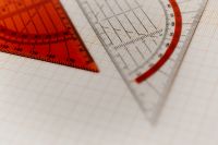 Kaboompics - Layered Clear Rulers on Squared Paper Background