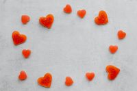 Kaboompics - Small Red Heart Candies Forming a Circle on Concrete Background
