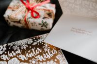 Kaboompics - Rustic Christmas Gift and Seasonal Card on Neutral Fabric