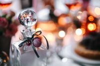 Kaboompics - Silver Ornament and Pink Baubles on a Glass Bottle