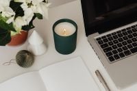 Kaboompics - White Flowers, Candle and Laptop in Minimal Workspace