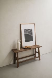 Kaboompics - Rustic Wooden Bench with Framed Art and Ceramic Decor