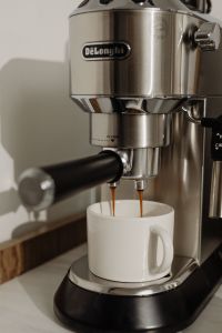 Kaboompics - Double Espresso Stream Pouring into a White Mug