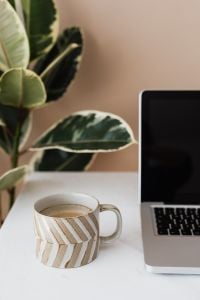 Home Office Desk Setup with Laptop and Coffee