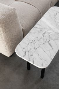 Kaboompics - Marble Coffee Table Detail Beside a Beige Bouclé Sofa