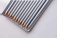 Kaboompics - Open Metal Tin of Silver Colored Pencils With Colorful Tips