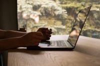 Kaboompics - Man Using a Laptop by a Window
