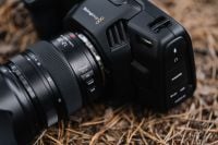 Kaboompics - Close-Up of Camera Lens and Black Cinema Camera Body Outdoors