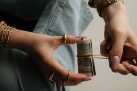 Kaboompics - Hands Wrapping Rolled Cash Financial Stability Aesthetic