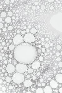 Kaboompics - Cluster of Large Round Bubbles in Dense White Foam, Vertical Macro Background