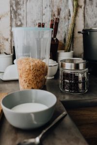 Containers of cereals in kitchen cupboard