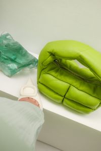 Kaboompics - Lime Green Handbag on a White Table in Sunlight
