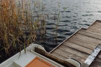 Kaboompics - Small Boat Beside a Weathered Wooden Dock