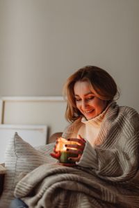 Kaboompics - Cocooning at Home: Woman with Candle and Blanket