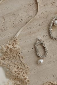 Kaboompics - Light Beige Lace Bra and Silver Jewelry Still Life